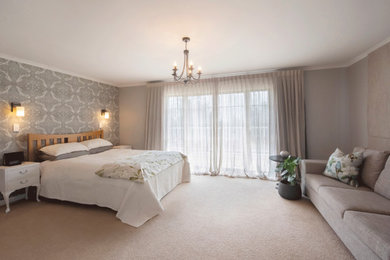 Bedroom - large master carpeted and wallpaper bedroom idea in Hamilton with beige walls