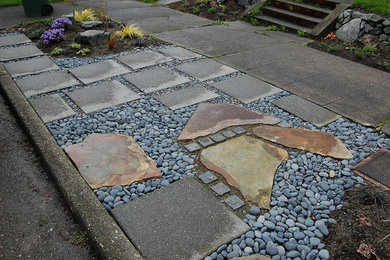 Inspiration for a mid-sized traditional full sun backyard concrete paver landscaping for spring.