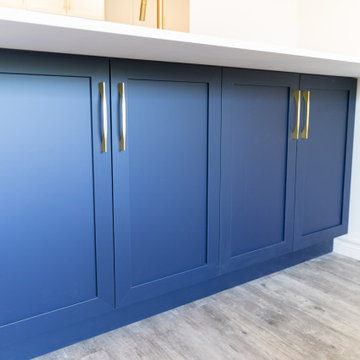 Blue under island cabinets