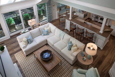 Example of a trendy medium tone wood floor living room design in Other