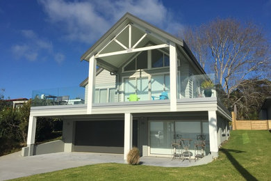 Photo of a beach style home design in Other.
