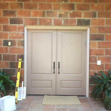 Before Photo of entry doors.