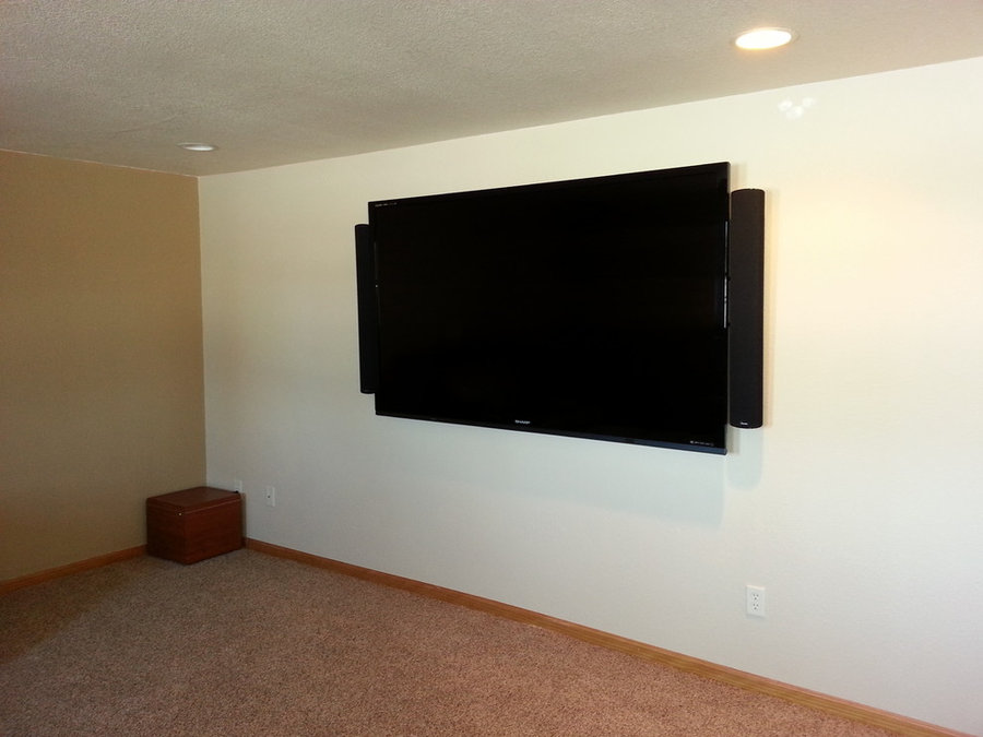 Large Wall-Mounted TV in Basement