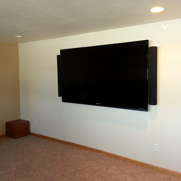 Large Wall-Mounted TV in Basement