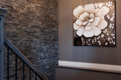 Example of a mid-sized classic wooden l-shaped mixed material railing staircase design in Toronto with wooden risers