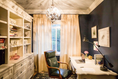 Example of a small classic freestanding desk light wood floor study room design in Seattle with black walls