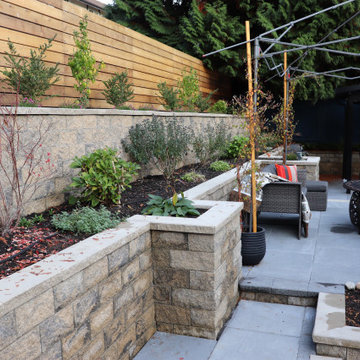 AFTER - Stepped retaining walls and cedar fence