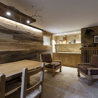 Design ideas for a large modern basement in Other with brown walls, limestone flooring, a corner fireplace, a wooden fireplace surround and beige floors.