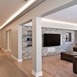 This is an example of a large classic look-out basement in Chicago with grey walls, bamboo flooring and no fireplace.