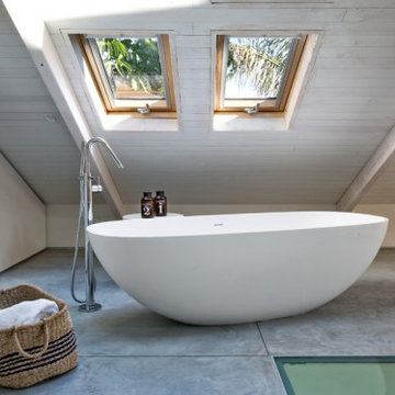 Master bedroom with an attic