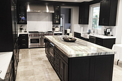 Inspiration for a large contemporary u-shaped ceramic tile and gray floor eat-in kitchen remodel in Los Angeles with an island, a single-bowl sink, flat-panel cabinets, black cabinets, onyx countertops, white backsplash, marble backsplash, stainless steel appliances and white countertops