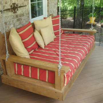 Low to ground composite deck in Macon GA with porch swing