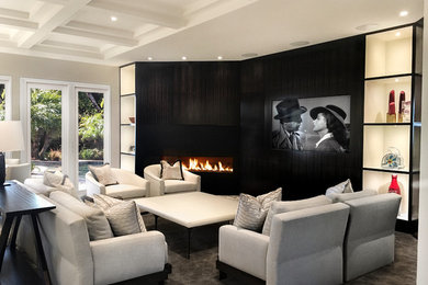 Example of a large trendy enclosed carpeted and gray floor family room design in Miami with gray walls, a ribbon fireplace, a media wall and a metal fireplace