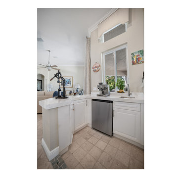 Updated Wet Bar with Stainless Steel Appliances and White Quartz in Davie