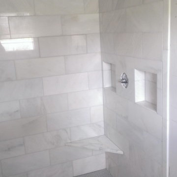 BATHROOM - Calcutta Gold Marble Shower / Gray Penny Tile Floor