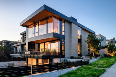 Mid-sized modern brick house exterior in Seattle with a flat roof.