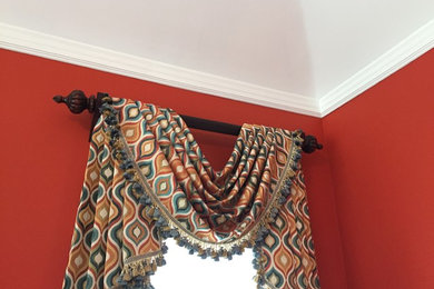Bedroom - traditional master carpeted bedroom idea in Other with red walls