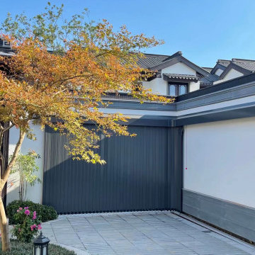 Side sliding automatic garage door for garages with no ceiling space.