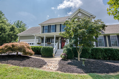 Inspiration for a farmhouse two-story exterior home remodel in Other