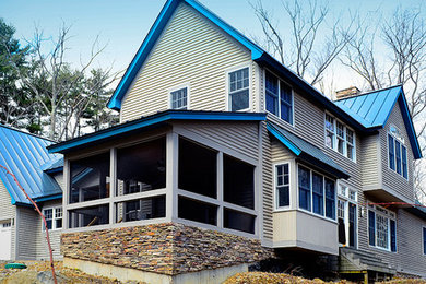 Example of a cottage exterior home design in Burlington