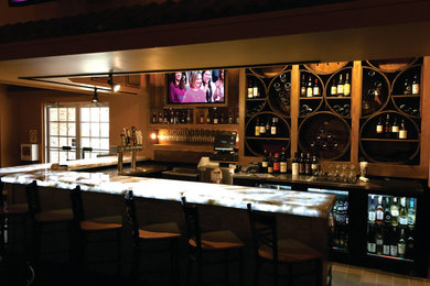 Example of an eclectic home bar design in Orange County