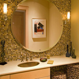Transitional multicolored tile and mosaic tile powder room photo in Dallas with recessed-panel cabinets, light wood cabinets and an undermount sink
