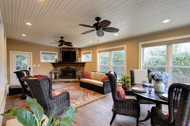 Large transitional ceramic tile sunroom photo in Atlanta with a corner fireplace, a stone fireplace and a standard ceiling