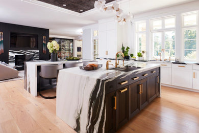 Eat-in kitchen - huge contemporary galley light wood floor, beige floor and tray ceiling eat-in kitchen idea in Tampa with an undermount sink, shaker cabinets, black cabinets, quartzite countertops, white backsplash, marble backsplash, white appliances, two islands and white countertops