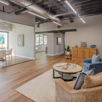 Industrial Office with Glass Conference Room and Open Lounge