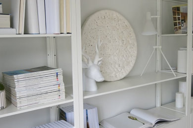 Example of a small danish enclosed living room design in Other with white walls