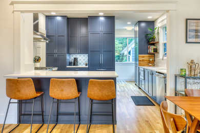 Example of a mid-sized classic home design design in Seattle