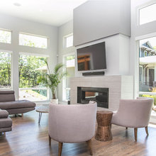 TV above Fireplace on white wall