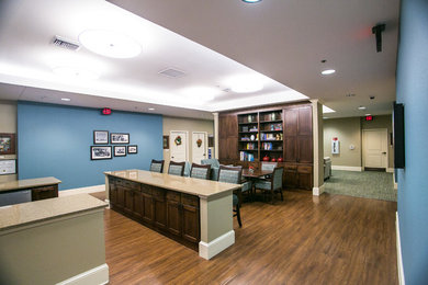 Mid-sized arts and crafts medium tone wood floor and brown floor kitchen/dining room combo photo in Austin with blue walls