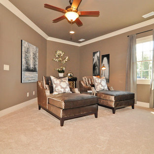 Inspiration for a mid-sized timeless enclosed carpeted and beige floor home theater remodel in Birmingham with brown walls and a wall-mounted tv