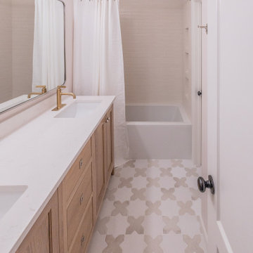 Playful Guest Bath Remodel with Fun Tile and Mixed Metals