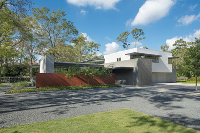 Example of a mid-sized trendy multicolored two-story mixed siding exterior home design in Houston with a shingle roof