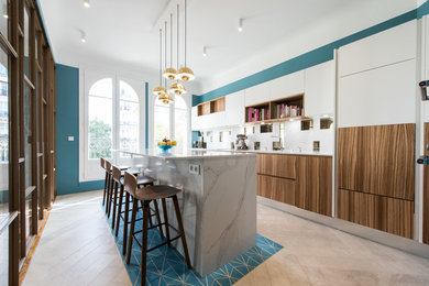 Photo of a contemporary kitchen in Paris with with island.