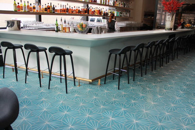 Example of a huge trendy concrete floor great room design in San Francisco with white walls