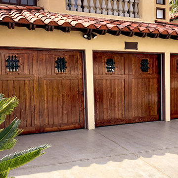 Mediterranean Wood Garage Doors with Iron Accessories