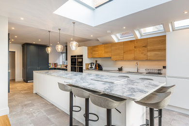 Design ideas for a contemporary kitchen in Hertfordshire with an island.