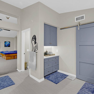 Custom Cabinetry with Soft Blue Finish and Modern Barn Door