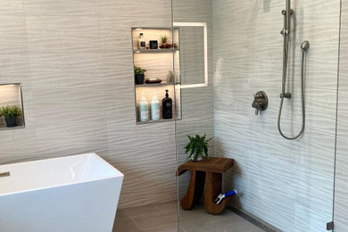 Bathroom - mid-sized modern master gray tile and porcelain tile porcelain tile and gray floor bathroom idea in Denver with flat-panel cabinets, quartz countertops, a floating vanity, gray countertops and a niche