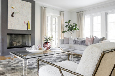 Example of a mid-sized transitional formal and open concept medium tone wood floor and brown floor living room design in New York with gray walls, a standard fireplace, a concrete fireplace and no tv