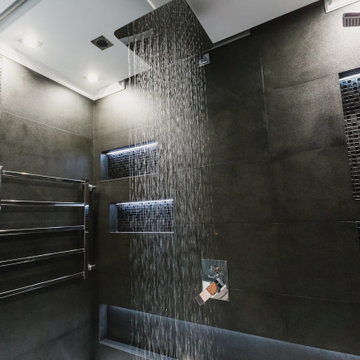 Trendy bathroom in dark color with LED lighting and sound system