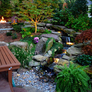Alexandria Sloped Yard - Raised Patio, Fire Pit, & Water Feature