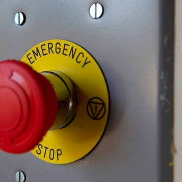 Custom car lift in California garage - emergency controls