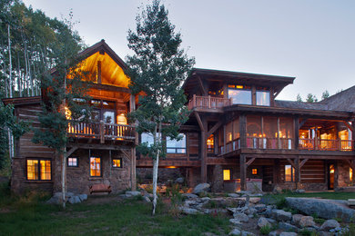 Inspiration for a rustic three-story wood exterior home remodel in Denver