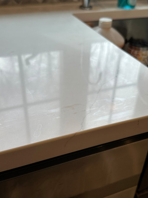 Brand new white Viatera quartz countertops have streaks allover them