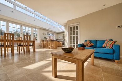 Inspiration for a medium sized classic open plan living room in Hertfordshire with white walls and terracotta flooring.