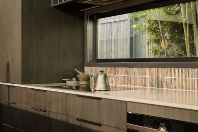 Inspiration for a mid-sized eclectic kitchen in Brisbane with black cabinets, quartz benchtops, with island and grey benchtop.